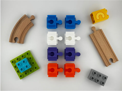 pack of eight Duplo to wooden train track adapters